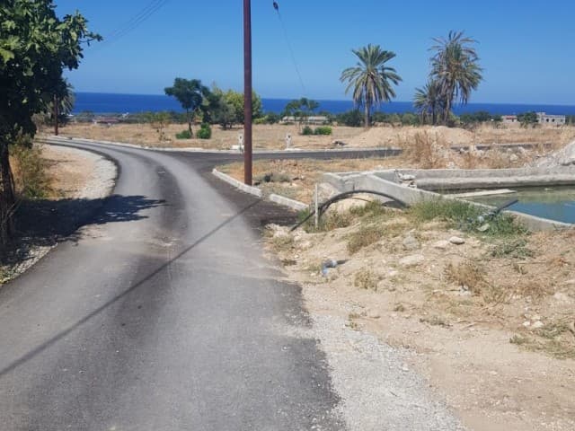 FOR SALE LAND SUITABLE FOR THE PRICE OF A RESIDENTIAL APARTMENT WITH A VIEW, CLOSE TO THE MAIN ROAD AND THE SEA IN TATLISU