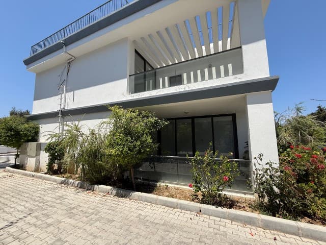 TWIN VILLA FOR RENT WITHOUT FURNITURE IN A GATED COMMUNITY WITH A POOL IN KYRENIA CITY CENTER